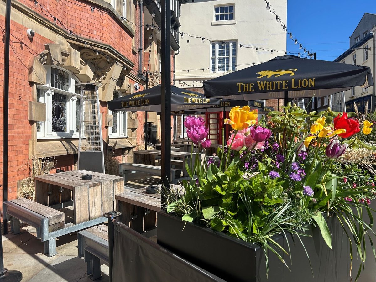 The beer garden at The White Lion — outdoor seating at the bottom of the historic Little Underbank