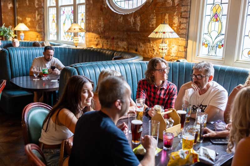 Upstairs dining room at The White Lion — warm, relaxed, food-led